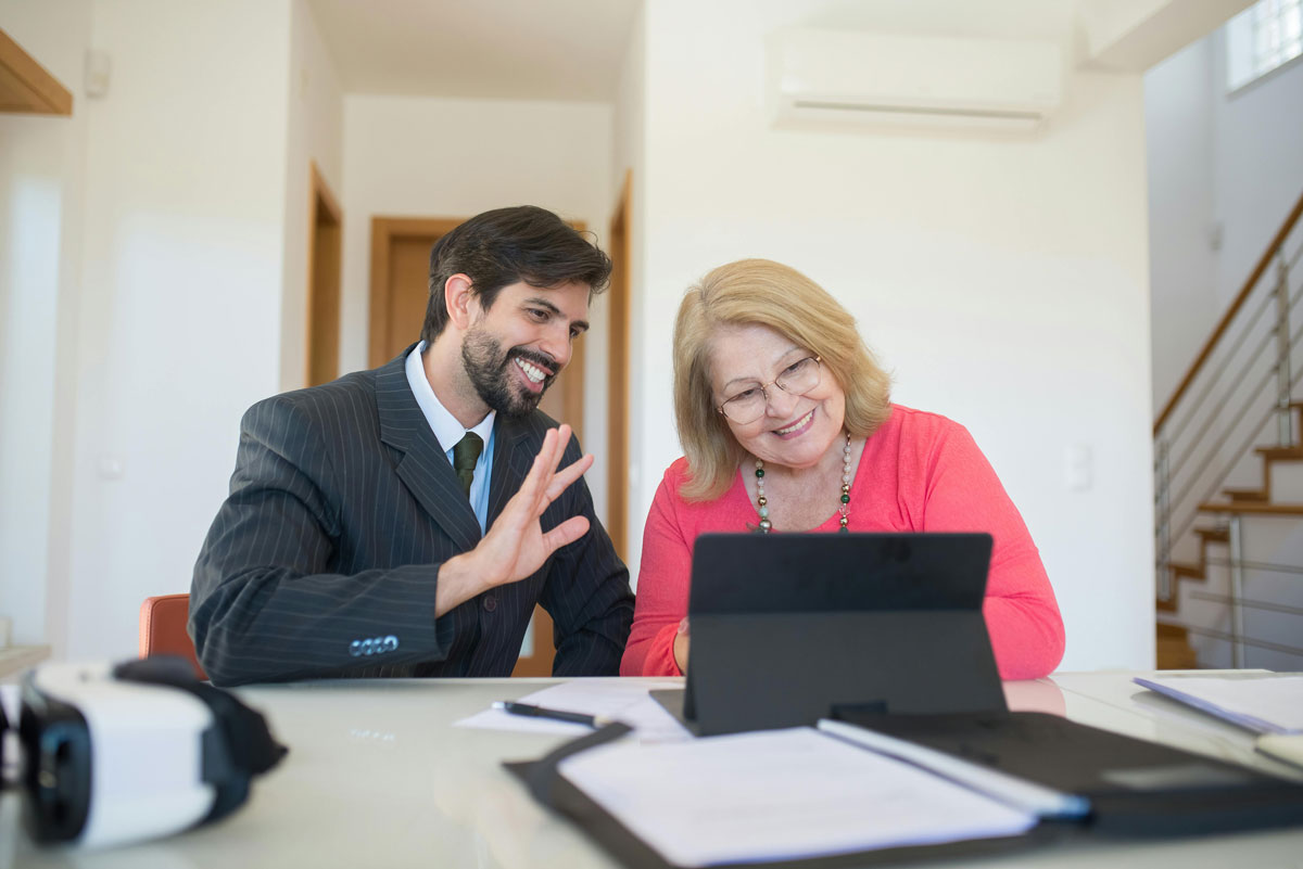 Man and woman in business attire on a conference call