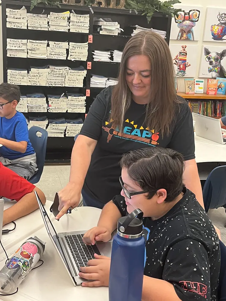 Tutor and student working on a laptop in the LEAP prgram