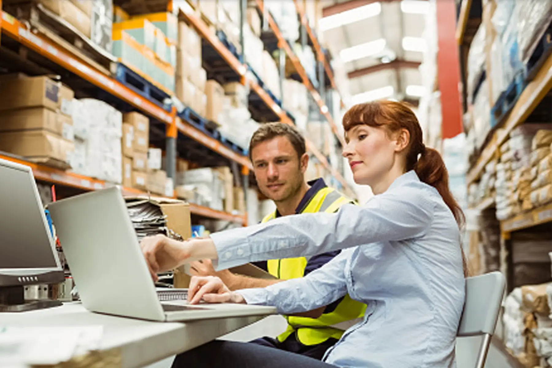 CES vendors reviewing data in a warehouse.